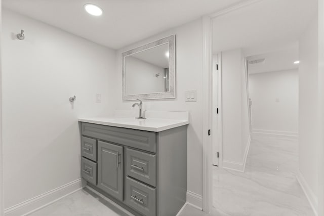 21984 Wildwood St, Dearborn, MI 48128 - bathroom with baseboards, vanity, recessed lighting, and marble look tiles