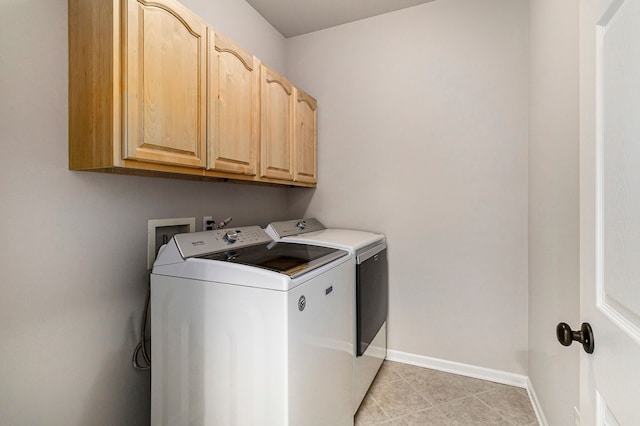 3736 Vicksburg Way, Howell, MI 48843 - clothes washing area featuring independent washer and dryer, cabinet space, baseboards, and light tile patterned floors