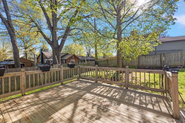 2015 Hazel Ave, Wixom, MI 48393 - wooden deck with a fenced backyard and a residential view