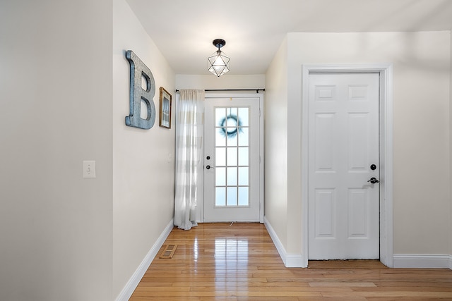 2015 Hazel Ave, Wixom, MI 48393 - entryway with light wood finished floors, plenty of natural light, and baseboards