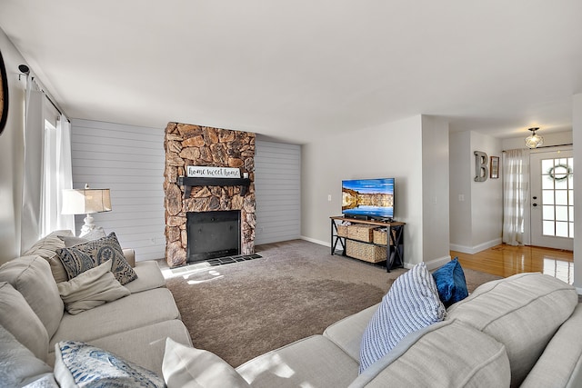 2015 Hazel Ave, Wixom, MI 48393 - living area with a fireplace, baseboards, and carpet floors
