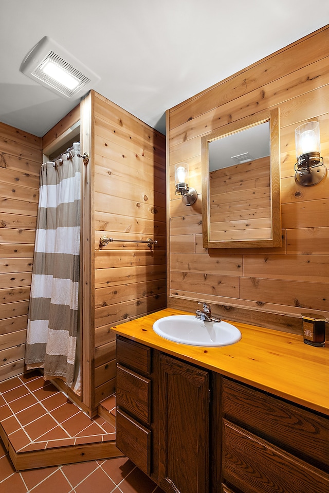 2015 Hazel Ave, Wixom, MI 48393 - bathroom featuring wood walls, tile patterned flooring, vanity, and a shower with curtain