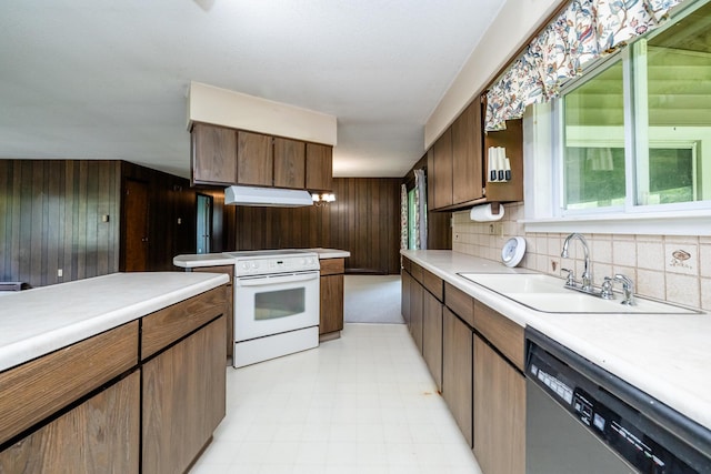 5575 Meadowbrook Rd, Eau Claire, MI 49111 - kitchen featuring white electric range oven, stainless steel dishwasher, under cabinet range hood, a sink, and light countertops
