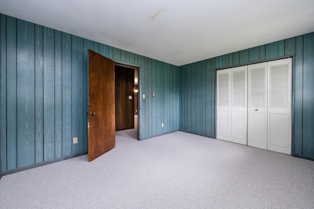5575 Meadowbrook Rd, Eau Claire, MI 49111 - unfurnished bedroom with carpet floors, a closet, and wood walls