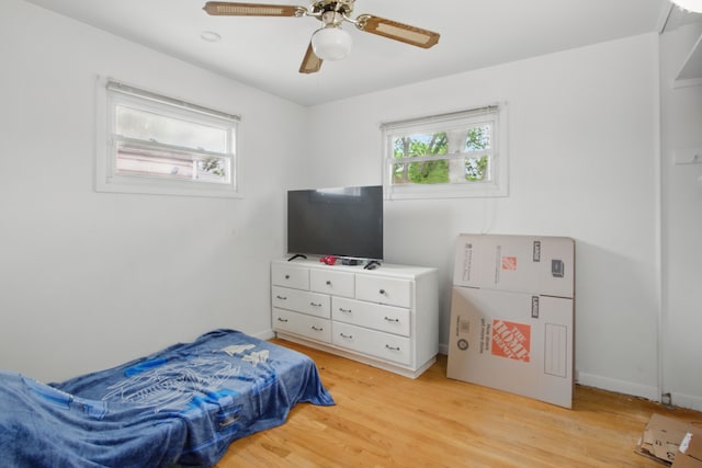 29660 Avondale St, Inkster, MI 48141 - bedroom with light wood finished floors, ceiling fan, and baseboards