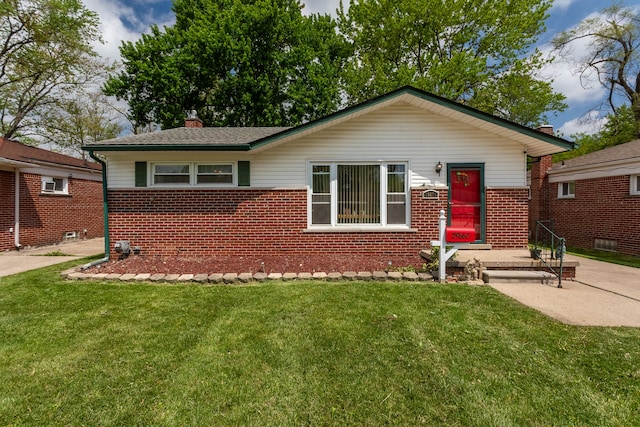 29660 Avondale St, Inkster, MI 48141 - view of front of home featuring brick siding, a chimney, and a front yard