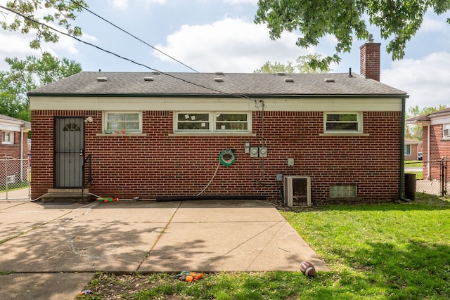 29660 Avondale St, Inkster, MI 48141 - rear view of property with a patio area, a chimney, entry steps, brick siding, and a shingled roof