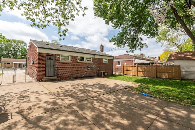 29660 Avondale St, Inkster, MI 48141 - back of property with brick siding, a gate, a patio area, and entry steps