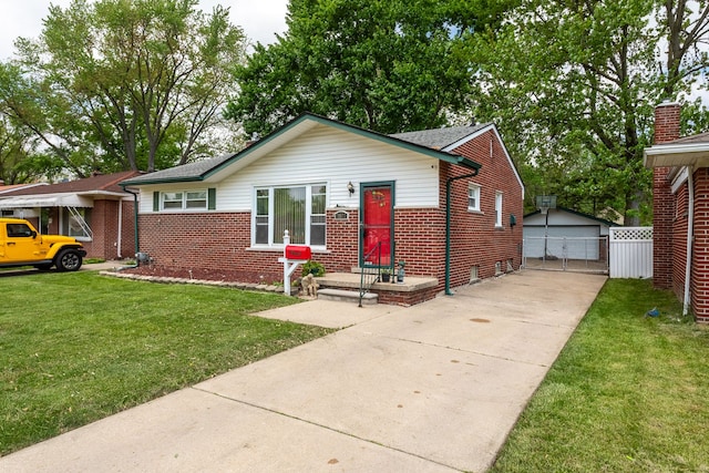 29660 Avondale St, Inkster, MI 48141 - bungalow featuring brick siding, a front yard, an outdoor structure, and a garage