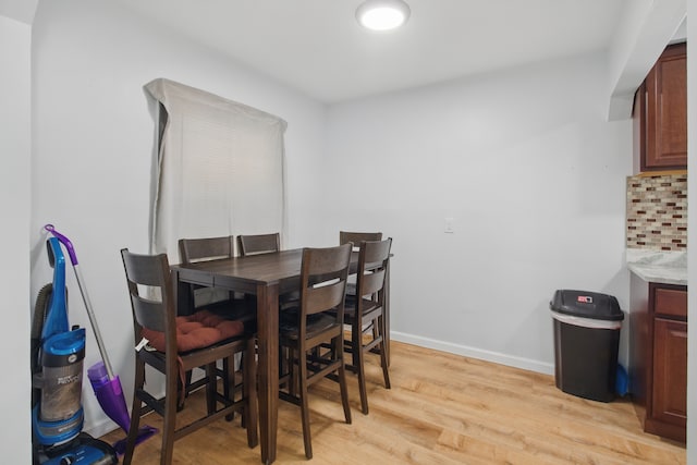 26613 W Hills Dr, Inkster, MI 48141 - dining space with light wood-style floors and baseboards