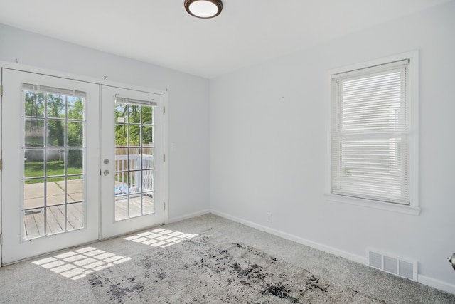 26613 W Hills Dr, Inkster, MI 48141 - carpeted empty room featuring french doors and baseboards