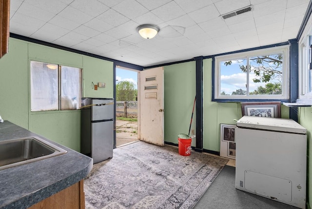 kitchen with dark countertops and a sink