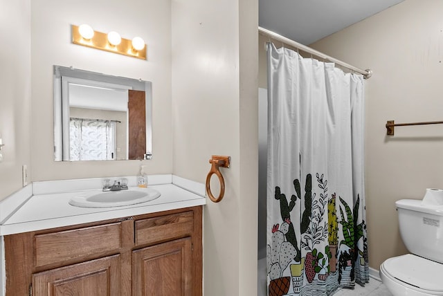 bathroom with toilet, vanity, curtained shower, and tile patterned flooring