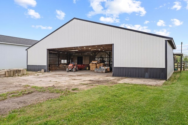 view of pole building with a yard