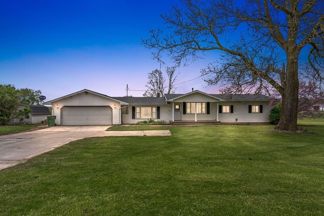 ranch-style house featuring an attached garage, a lawn, concrete driveway, and covered porch