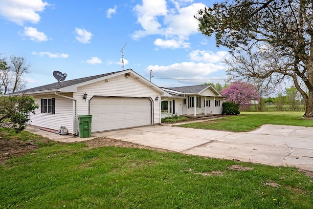 single story home with an attached garage, concrete driveway, a front yard, and covered porch