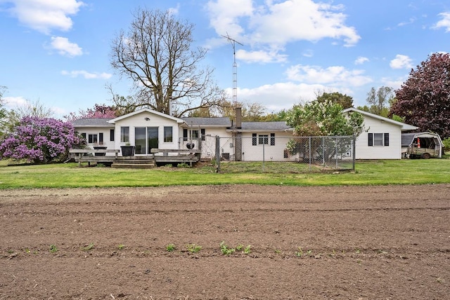 back of house featuring a deck