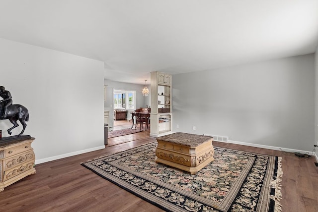 living room featuring wood finished floors and baseboards