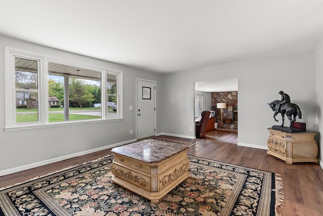 living area featuring wood finished floors and baseboards