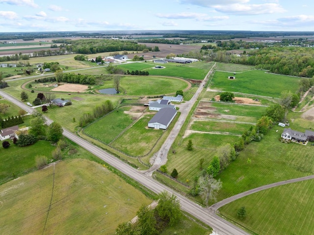 aerial view of property's location featuring rural landscape and a nearby body of water