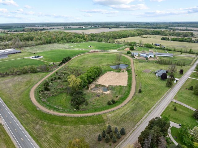 aerial view of property's location featuring a nearby body of water and rural landscape