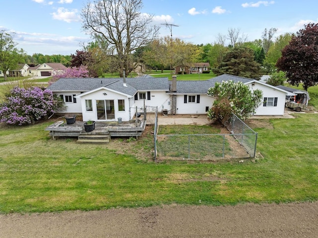 back of house with a wooden deck and roof with shingles