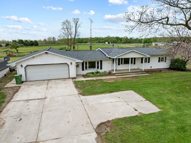 ranch-style house featuring covered porch, driveway, an attached garage, and a front lawn