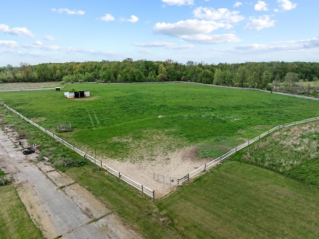 overview of rural landscape featuring agricultural land and a forest
