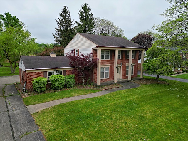 4003 Old Dominion Dr, West Bloomfield, MI 48323 - view of front of home with brick siding and a front yard
