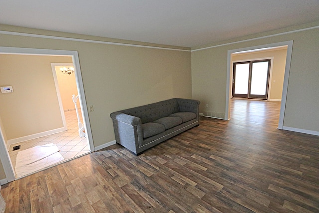 4003 Old Dominion Dr, West Bloomfield, MI 48323 - living area with dark wood-style floors, a chandelier, and baseboards
