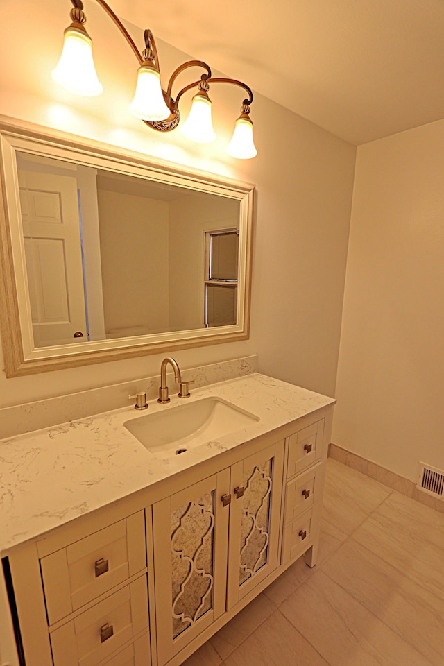 4003 Old Dominion Dr, West Bloomfield, MI 48323 - bathroom featuring vanity, tile patterned floors, and baseboards