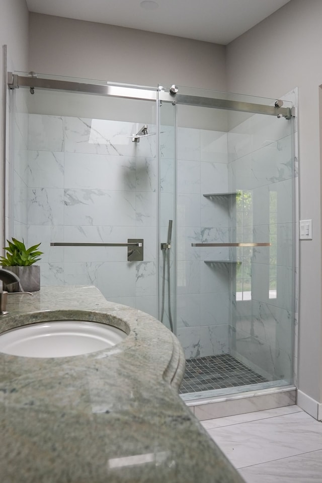 278 W Saint Clair St, Romeo, MI 48065 - bathroom with marble look tile flooring, a marble finish shower, and a sink
