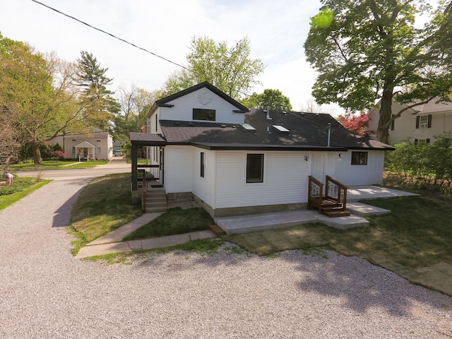 278 W Saint Clair St, Romeo, MI 48065 - back of house with entry steps and a shingled roof