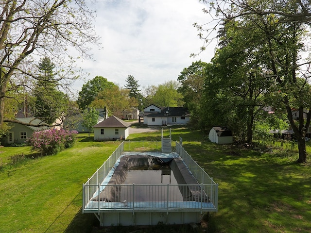 278 W Saint Clair St, Romeo, MI 48065 - view of green lawn with an outbuilding, a shed, and a wooden deck