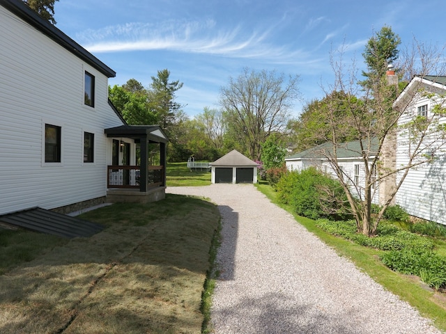 278 W Saint Clair St, Romeo, MI 48065 - view of yard featuring an outbuilding and a garage