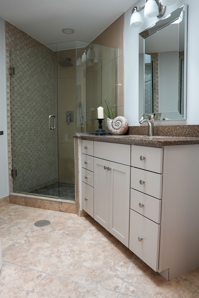 278 W Saint Clair St, Romeo, MI 48065 - bathroom featuring tile patterned floors, a shower stall, and vanity