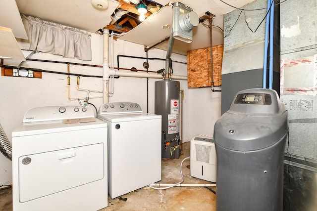 laundry room with gas water heater and separate washer and dryer