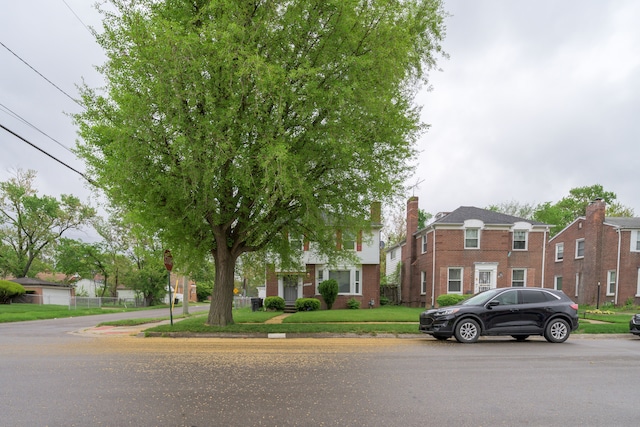 view of front of house with brick siding and a residential view