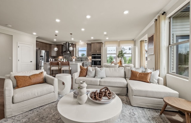 55697 Oak Pointe Dr, Utica, MI 48315 - living room with ornamental molding, recessed lighting, and baseboards