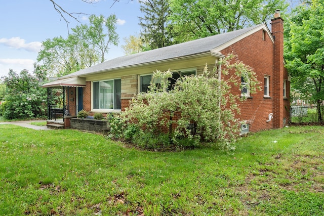 view of home's exterior featuring a chimney and brick siding
