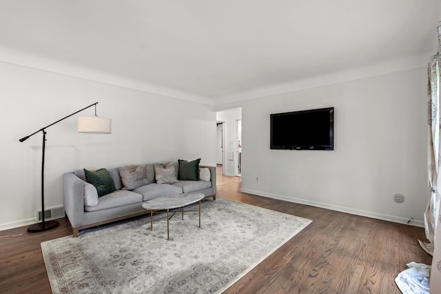 living area with dark wood finished floors and baseboards