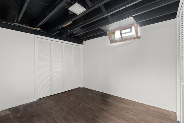 basement featuring dark wood-style flooring