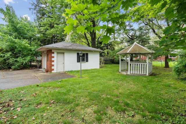view of yard featuring an outbuilding and a gazebo