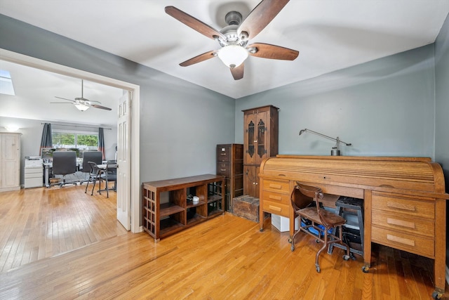 office area featuring a ceiling fan and wood-type flooring