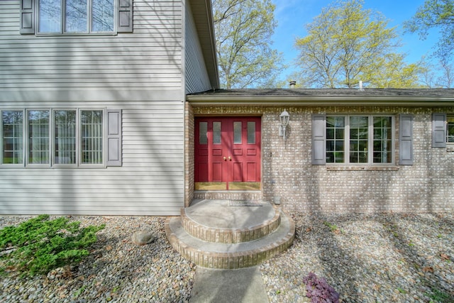 216 Wickenham Dr, Spring Arbor, MI 49283 - doorway to property with brick siding
