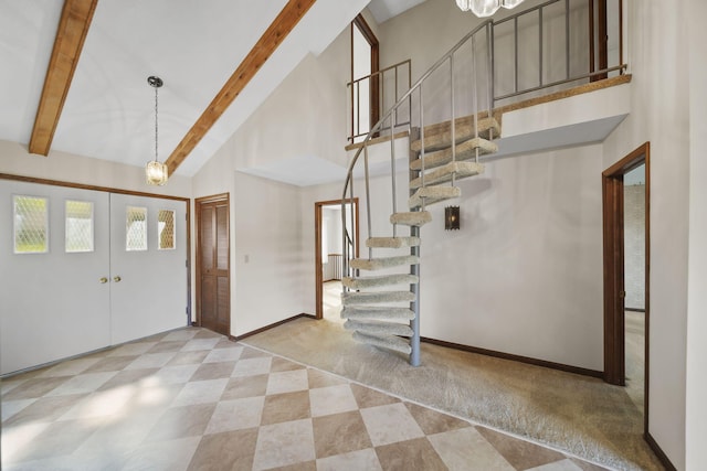 216 Wickenham Dr, Spring Arbor, MI 49283 - foyer entrance with high vaulted ceiling, stairs, beam ceiling, baseboards, and carpet floors