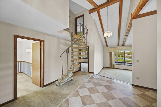 216 Wickenham Dr, Spring Arbor, MI 49283 - entryway with carpet, a chandelier, beam ceiling, high vaulted ceiling, and stairs