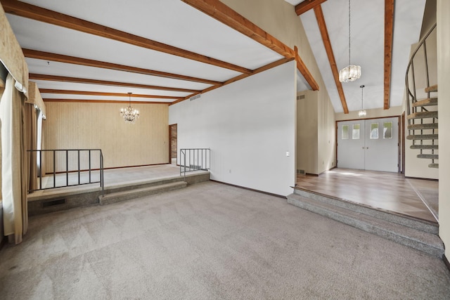 216 Wickenham Dr, Spring Arbor, MI 49283 - unfurnished room with a chandelier, carpet flooring, and stairs