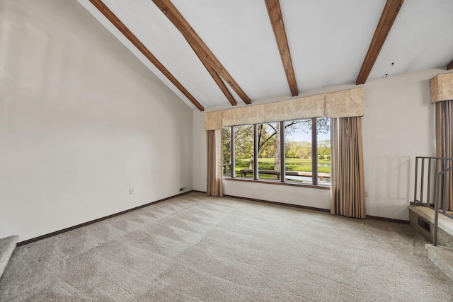 216 Wickenham Dr, Spring Arbor, MI 49283 - unfurnished living room with light carpet, beam ceiling, baseboards, and high vaulted ceiling
