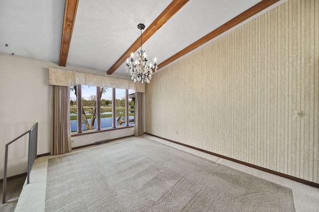 216 Wickenham Dr, Spring Arbor, MI 49283 - unfurnished living room with carpet flooring, a chandelier, beam ceiling, and baseboards